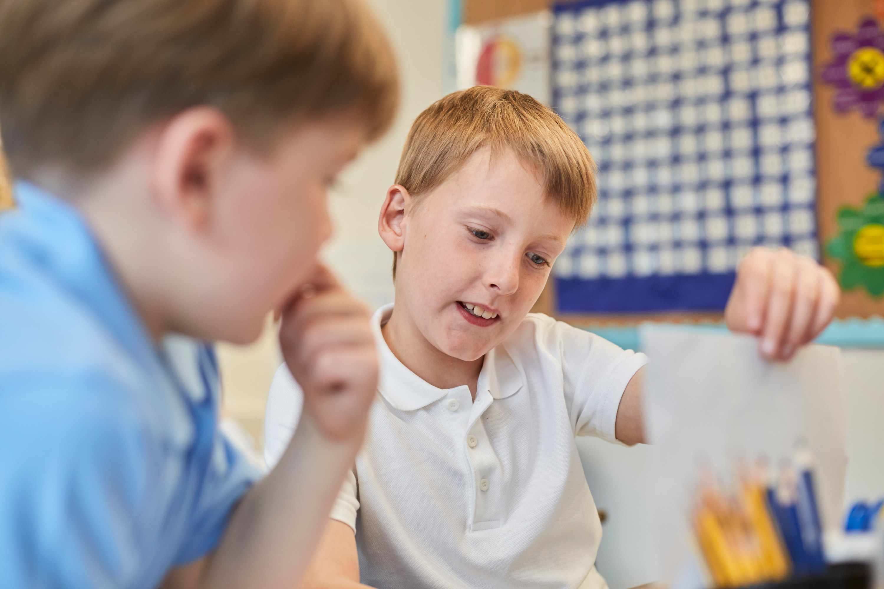 Two Boys Engaged In A Lively Discussion Over School